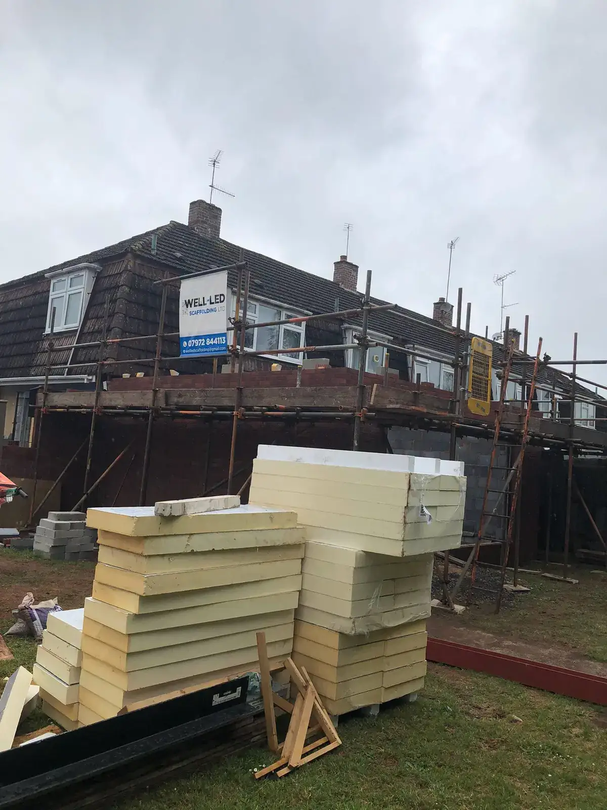 Scaffolding to the rear of a house undergoing renovation and extension in Exeter, Devon.